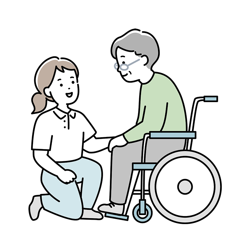 車椅子に座っている高齢者とひざまずいて手を繋ぐ人物。二人は会話をしているようだ。.